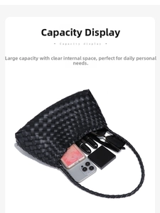 Capacity display of black woven tote showing smartphone, lipstick, and sunglasses