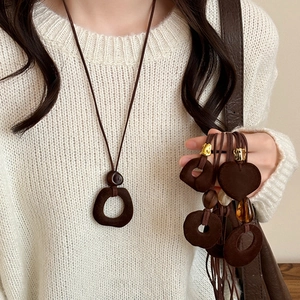 Brown flocked resin pendant necklace on a long cord for autumn and winter vintage style