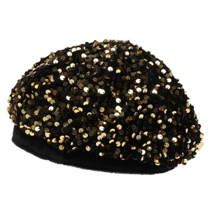 Detail of velvet beret featuring dense gold sequins and soft plush texture