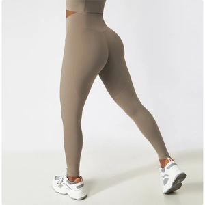 Detail view of coffee brown high waisted yoga pants with side seams and quick dry fabric