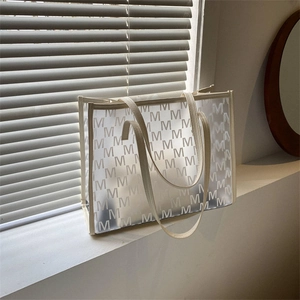 Large capacity semi-transparent frosted tote bag with letter M pattern and beige handles