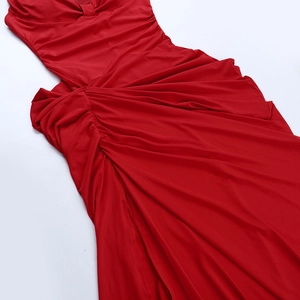 Detailed macro view of the dense pleat texture on this red backless bodycon dress