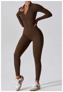 Detail view of the deep brown long-sleeve yoga bodysuit with front zipper and stand collar