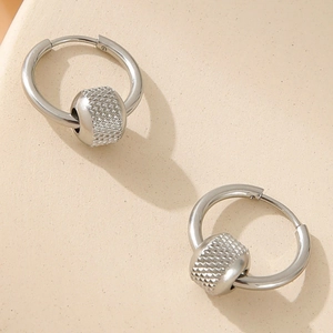 Minimalist silver stainless steel hoop earrings featuring textured knurled beads