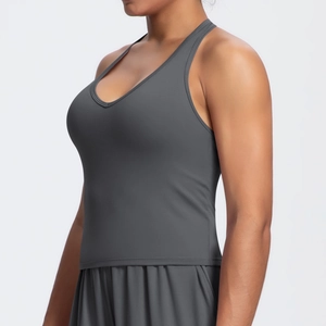 Detail of grey V-neck sports bra featuring racerback design and elastic moisture-wicking fabric