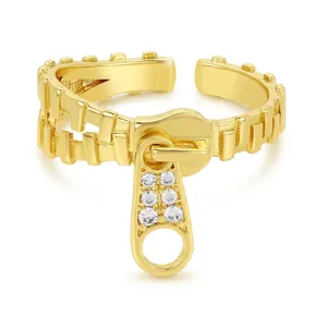 Adjustable gold-plated zipper ring for women with zircon inlays on a white background