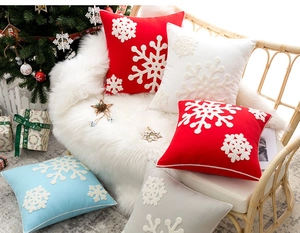 Macro view of Christmas pillow covers featuring exquisite 3D snowflake embroidery detail