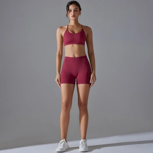 Detailed texture of seamless burgundy yoga set showing ribbed waistband and elastic fabric