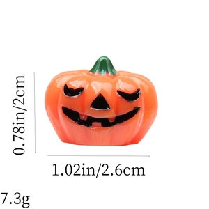Detail view of orange pumpkin decoration with size 0.78x1.02in and weight 7.3g