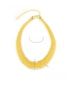 Detail of gold titanium steel woven chain necklace with extension link and clasp
