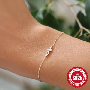 Minimalist 925 sterling silver gold bracelet with round cubic zirconia on model wrist