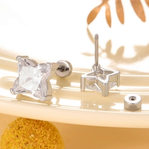 Star-shaped zircon ear studs with screw-back design in polished silver-tone titanium steel