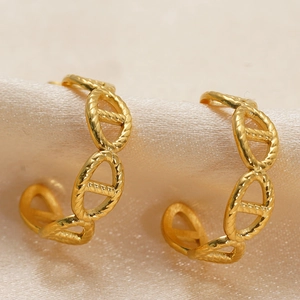 Polished 18K gold pleated geometric anchor chain stud earrings on beige silk
