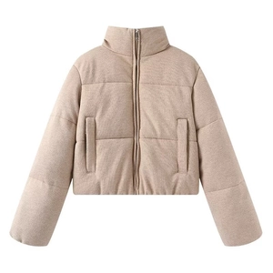 Close-up of khaki quilted puffer jacket with stand collar and detailed knit texture