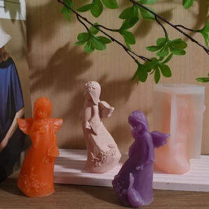 Silicone mold for angel girl candle with flower wreath and three finished candle figures