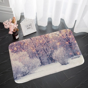 Close-up of winter forest snow scene printed on a cozy flannel absorbent door mat