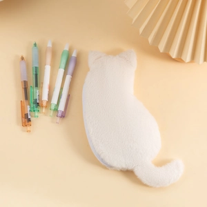 White plush cat pencil case with soft faux fur, cute ears and long tail on warm background
