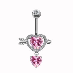 Macro view of heart belly button ring with pink gem, arrow detail and silver finish