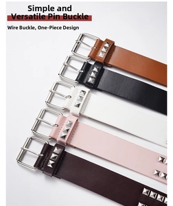 Close-up of five color variants of rivet studded PU leather belts with silver pin buckles