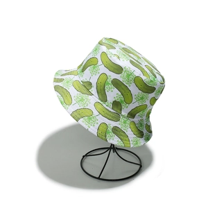 Close-up of white cotton bucket hat with all-over cucumber and flower print on stand
