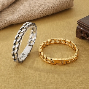Vintage embossed silver and gold stainless steel Cuban link bracelets in retro style