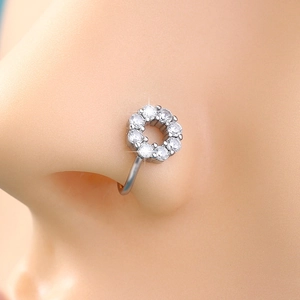 Detailed macro shot of a silver non-piercing nose ring with inlaid clear crystals