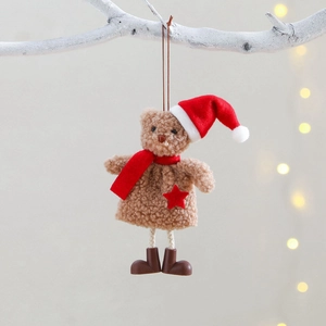 Plush Christmas bear hanging ornament with red hat and scarf on white branches
