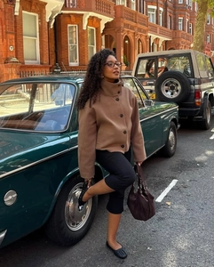 Chic brown stand-collar wool jacket styled with a vintage car in a city setting