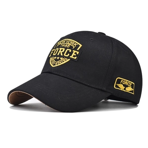 Close-up of yellow 1985 FORCE embroidery on black cotton twill baseball cap fabric