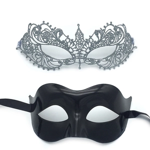 Detail of silver glitter cutout lace mask and black glossy masquerade eye mask