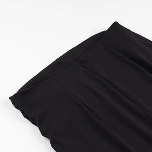 Detailed view of black knitted skirt waist with high-quality invisible zipper