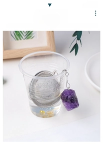 Macro detail of natural amethyst stone tea strainer with 304 stainless steel mesh infuser
