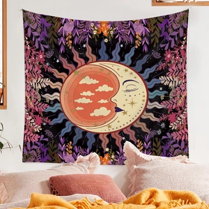 Detailed Bohemian tarot tapestry with sun moon design hanging above a cozy bed set