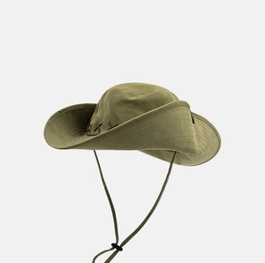 Close-up of olive green sun hat featuring side cross-stitch detail and adjustable chin cord