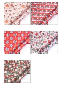 Detail showing five assorted Christmas wrapping paper patterns with festive holiday designs