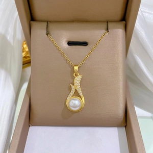 Elegant gold titanium steel necklace with pavé zircons and a large white pearl pendant