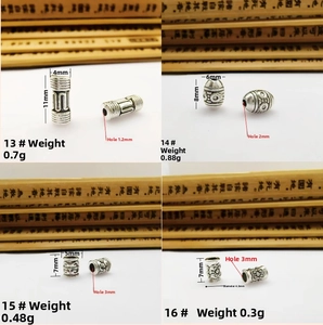 Macro view of vintage silver spacer beads with tribal engravings for DIY jewelry making