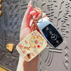 Cute Capybara spinning keychain with LED light for bags and keys in cream yellow