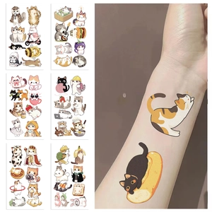 Detail of cute watercolor cat temporary tattoos applied on skin for children party decoration