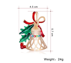 Detailed view of Christmas bell brooch with red bow and dimensions 4.5 cm by 5.7 cm