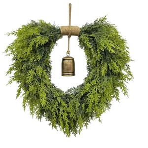 Christmas heart-shaped cedar wreath with vintage bronze metal bell on white background