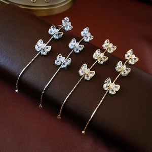 Elegant gold and silver butterfly tassel earrings featuring sparkling zircon crystal details