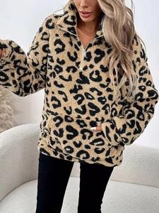 Detail of leopard print fleece pullover with quarter-zip collar and large front pocket