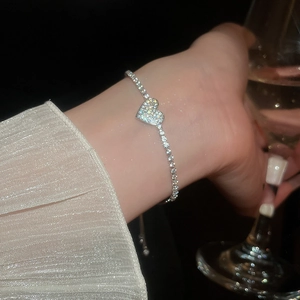Sparkling zircon heart pendant on a luxury tennis bracelet with adjustable sliding clasp