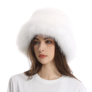 Close-up of white fluffy faux fur winter bucket hat showing premium plush texture