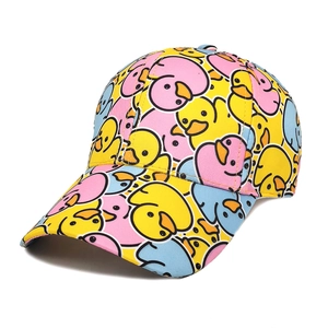 Close-up detail of cartoon duck pattern and cotton twill fabric on the baseball cap