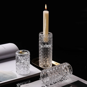 Elegant diamond-cut crystal glass candle holders for a romantic dining table centerpiece