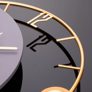 Modern minimalist luxury wall clock with a gold metal frame and lavender purple dial