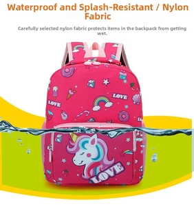 Close-up of waterproof nylon material featuring unicorn and rainbow cartoon patterns