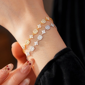 Close-up of gold and silver plated adjustable flower bracelets with zircon on a wrist